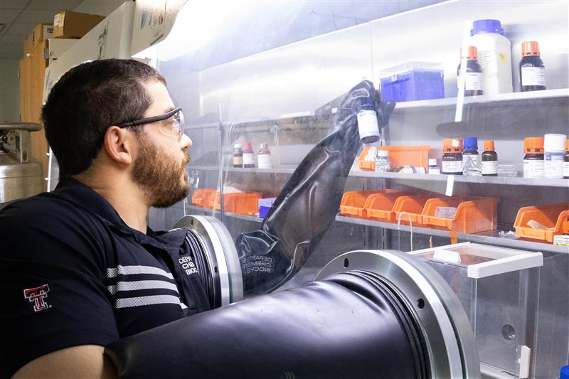 Scientist Using a Glove Box